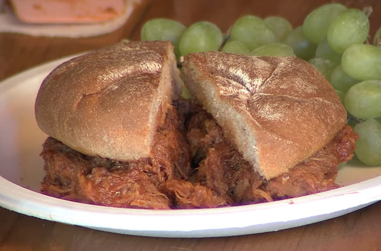 Photo of maple pulled pork sandwich with green grapes